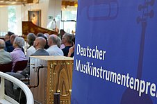 Musikinstrumentenpreis Hinweisschild