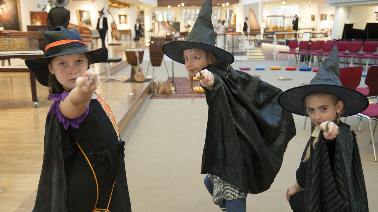 Photo of three children dressed as witches