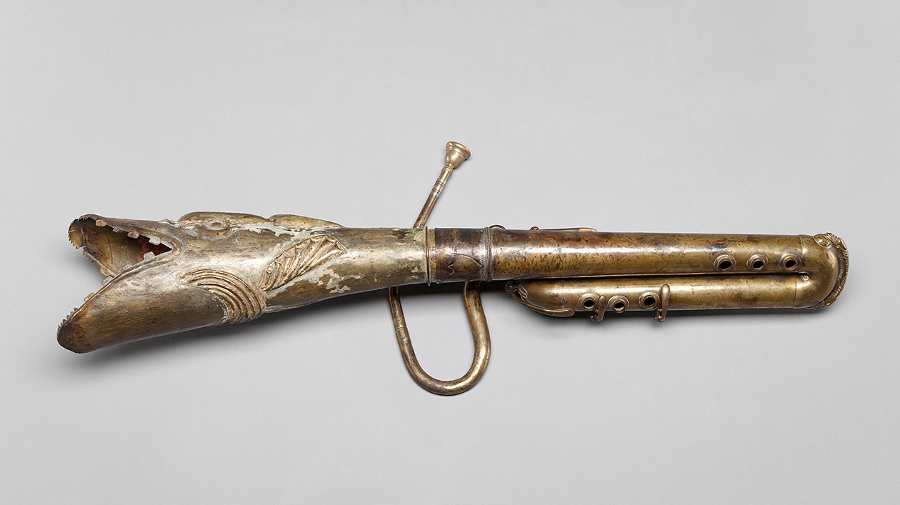 Horizontal elongated wind instrument with dragon head